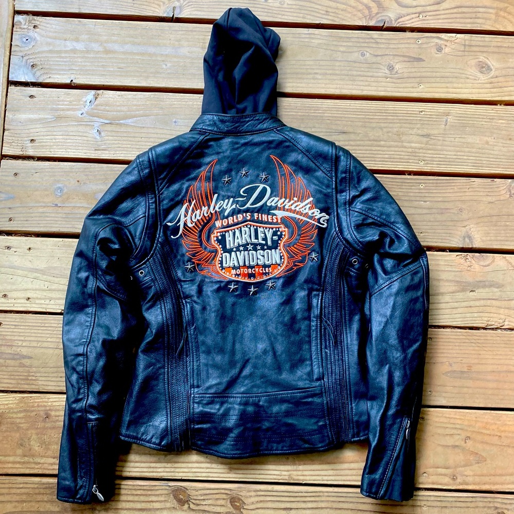Like new Harley Davidson womens fitted leather jacket with hoodie liner.